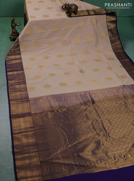 Semi kanchipuram silk saree beige and navy blue with allover zari weaves & buttas and zari woven border