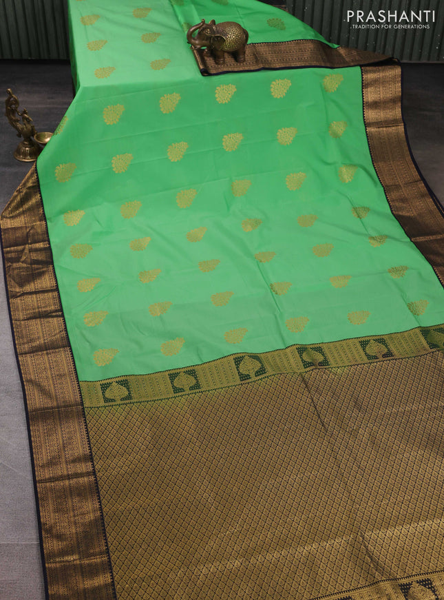 Semi kanchipuram silk saree teal green and navy blue with zari woven buttas and zari woven border