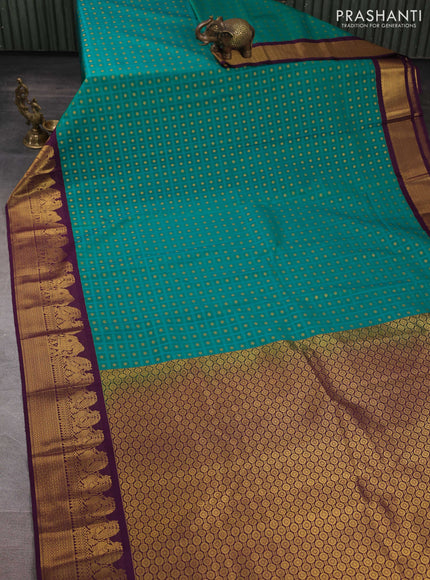 Semi kanchipuram silk saree teal green and deep purple with allover checks & zari woven buttas and zari woven korvai border