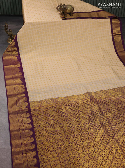 Semi kanchipuram silk saree cream and deep purple with allover checks & zari woven buttas and zari woven korvai border
