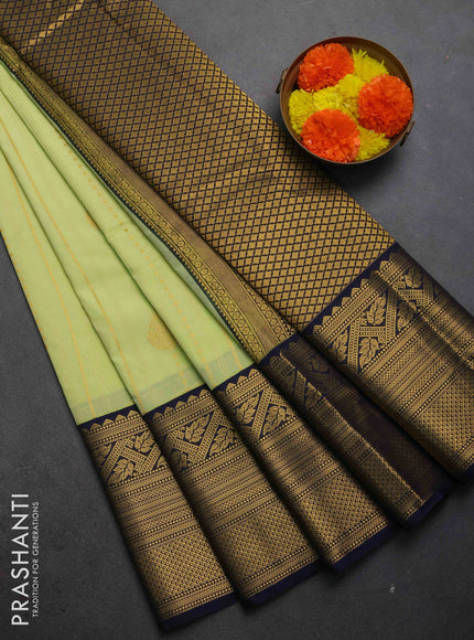 Semi kanchipuram silk saree pista green and navy blue with allover zari weaves & buttas and long zari woven korvai border