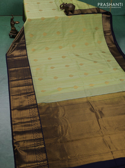 Semi kanchipuram silk saree pista green and navy blue with allover zari weaves & buttas and long zari woven korvai border