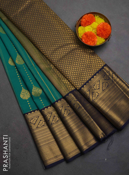Semi kanchipuram silk saree green and navy blue with allover zari weaves & buttas and long zari woven korvai border