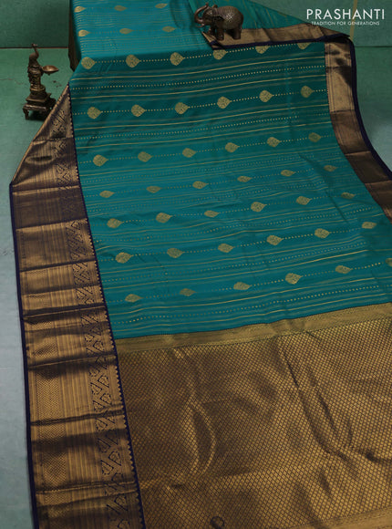 Semi kanchipuram silk saree green and navy blue with allover zari weaves & buttas and long zari woven korvai border