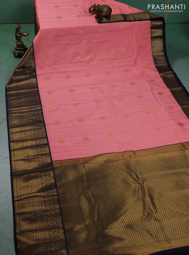 Semi kanchipuram silk saree peach pink and navy blue with allover zari weaves & buttas and long zari woven korvai border