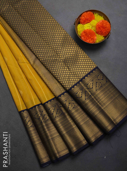 Semi kanchipuram silk saree mustard yellow and navy blue with allover zari weaves & buttas and long zari woven korvai border