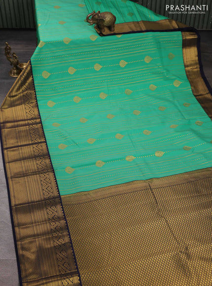 Semi kanchipuram silk saree teal green and navy blue with allover zari weaves & buttas and long zari woven korvai border