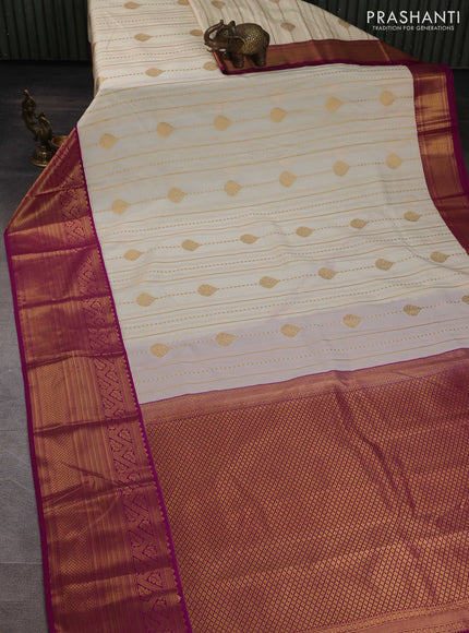 Semi kanchipuram silk saree cream and purple with allover zari weaves & buttas and long zari woven korvai border