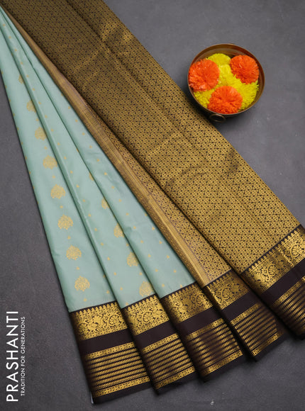 Semi kanchipuram silk saree pastel blue and coffee brown with allover zari woven buttas and zari woven korvai border