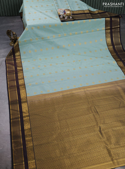 Semi kanchipuram silk saree pastel blue and coffee brown with allover zari woven buttas and zari woven korvai border