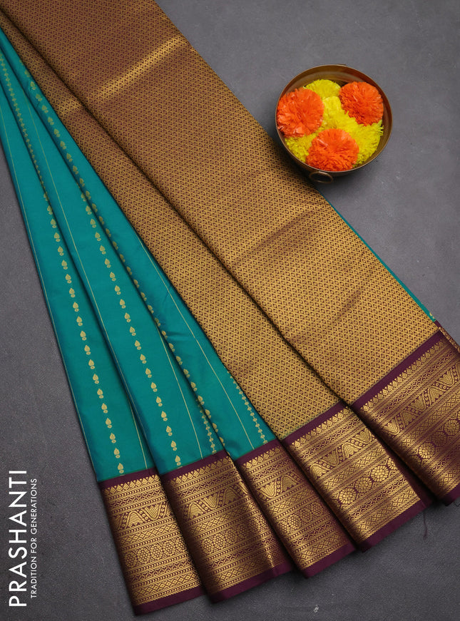 Semi kanchipuram silk saree teal blue and purple with allover zari weaves & buttas and zari woven border