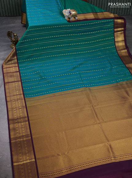 Semi kanchipuram silk saree teal blue and purple with allover zari weaves & buttas and zari woven border