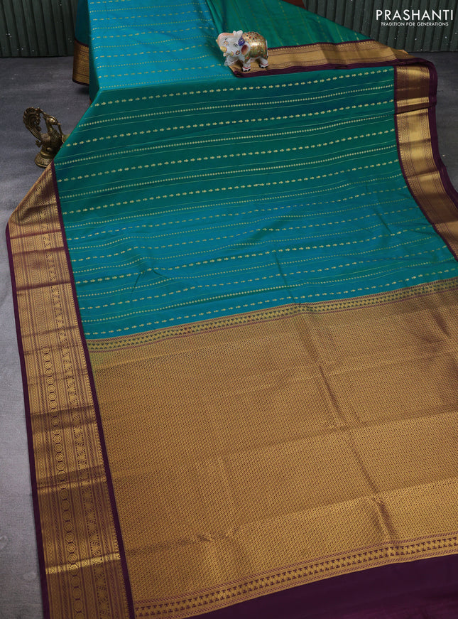 Semi kanchipuram silk saree teal blue and purple with allover zari weaves & buttas and zari woven border