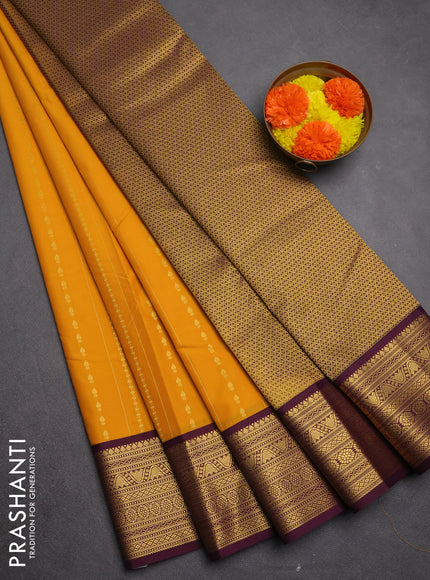 Semi kanchipuram silk saree mustard yellow and purple with allover zari weaves & buttas and zari woven border