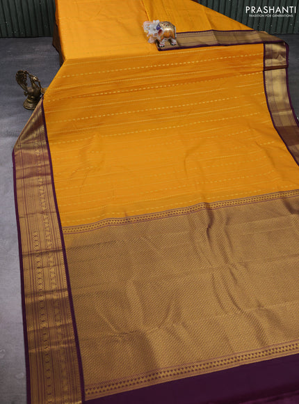 Semi kanchipuram silk saree mustard yellow and purple with allover zari weaves & buttas and zari woven border