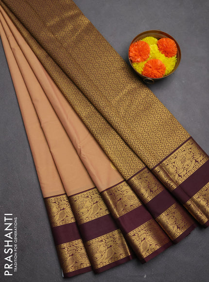 Semi kanchipuram silk saree sandal and deep maroon with allover zari woven buttas and rettapet zari woven border