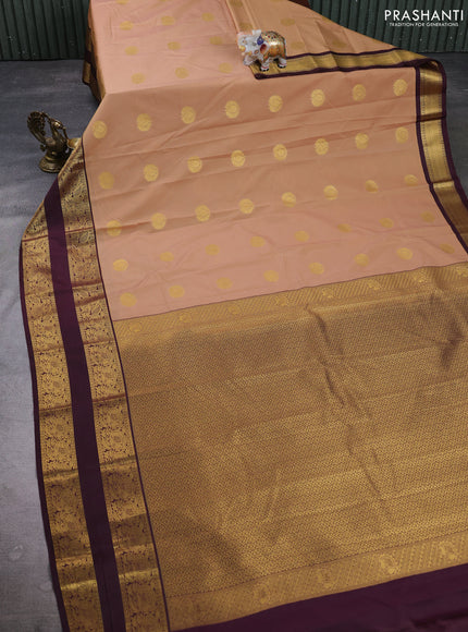 Semi kanchipuram silk saree sandal and deep maroon with allover zari woven buttas and rettapet zari woven border