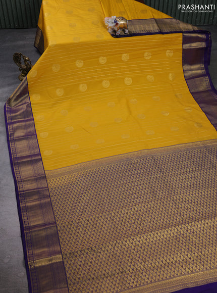 Semi kanchipuram silk saree mustard yellow and blue with allover zari weaves & buttas and zari woven korvai border