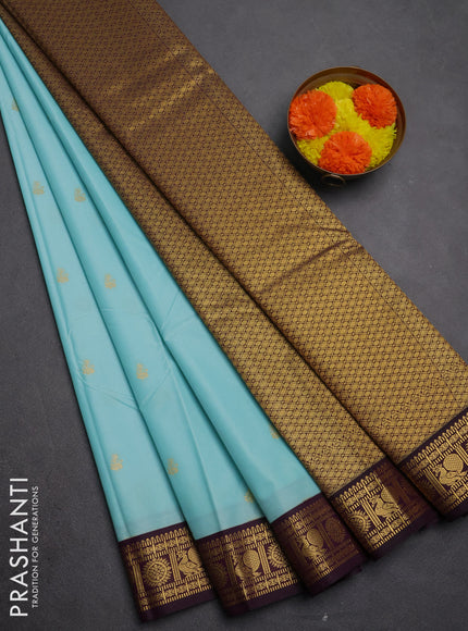 Semi kanchipuram silk saree light blue and deep purple with allover zari woven buttas and zari woven korvai border