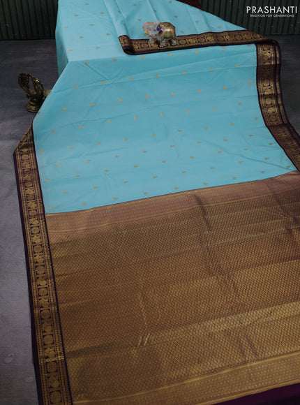 Semi kanchipuram silk saree light blue and deep purple with allover zari woven buttas and zari woven korvai border