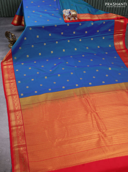 Semi kanchipuram silk saree dual shade of bluish green and red with zari woven buttas and zari woven korvai border