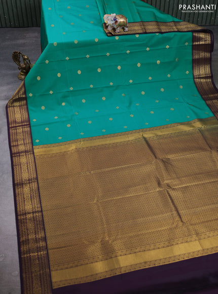 Semi kanchipuram silk saree teal green and deep purple with zari woven buttas and zari woven korvai border