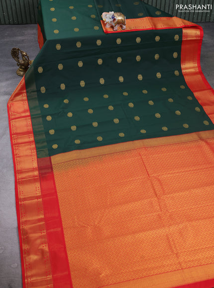 Semi kanchipuram silk saree bottle green and orange with zari woven buttas and long zari woven korvai border
