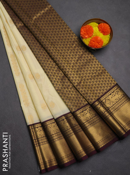 Semi kanchipuram silk saree cream and deep maroon with zari woven buttas and long zari woven border