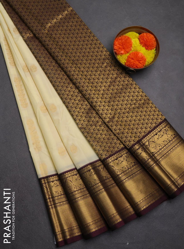 Semi kanchipuram silk saree cream and deep maroon with zari woven buttas and long zari woven border