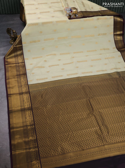 Semi kanchipuram silk saree cream and deep maroon with zari woven buttas and long zari woven border
