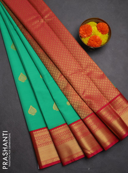 Semi kanchipuram silk saree teal green and pink with zari woven buttas and zari woven border