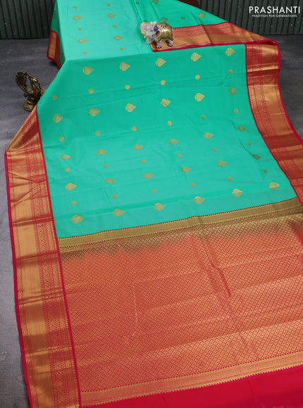 Semi kanchipuram silk saree teal green and pink with zari woven buttas and zari woven border
