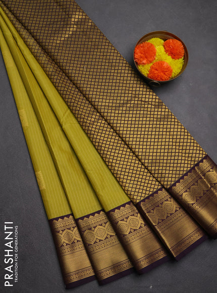 Semi kanchipuram silk saree lime green and deep purple with allover zari weaves & buttas and zari woven korvai border