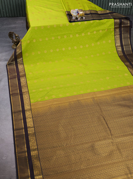 Semi kanchipuram silk saree light green and coffee brown with allover zari woven buttas and zari woven korvai border