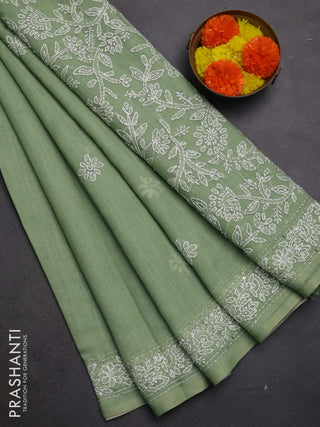 Khadi linen cotton saree pastel green with embroidery buttas and kantha stitch work pallu & border