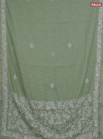 Khadi linen cotton saree pastel green with embroidery buttas and kantha stitch work pallu & border
