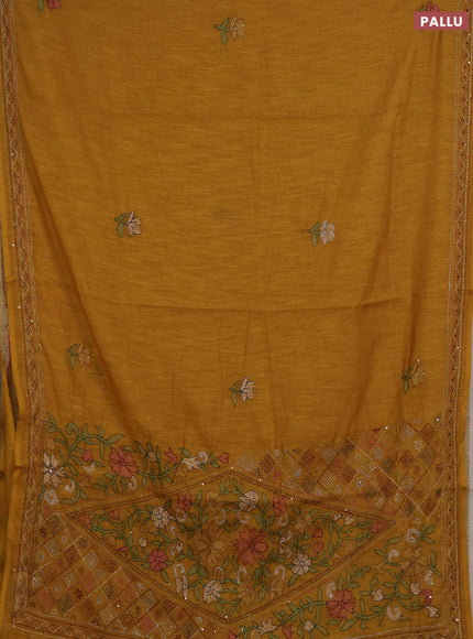 Khadi linen cotton saree mustard yellow with floral embroidery buttas and kantha stitch work pallu & border