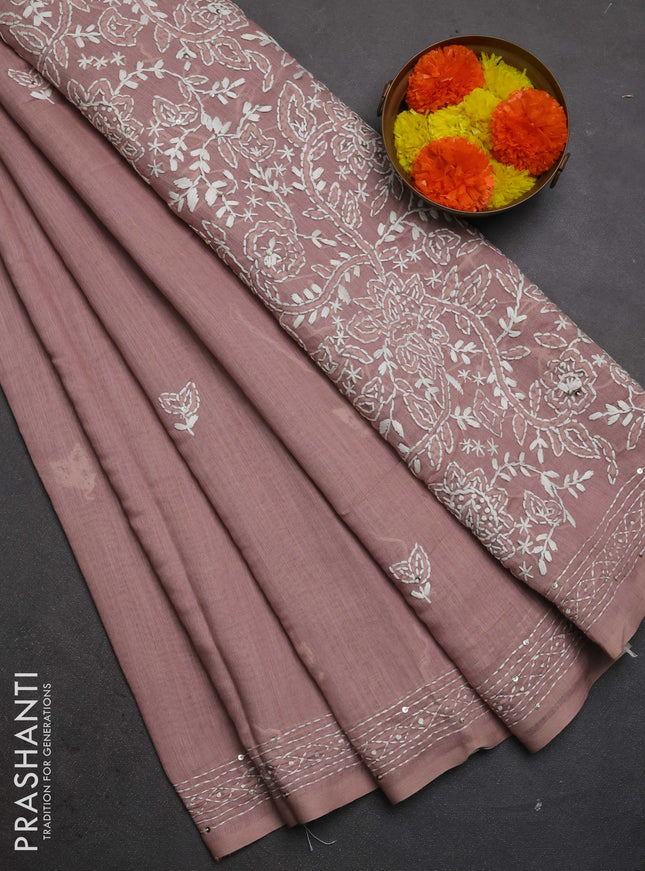 Khadi linen cotton saree pastel pink shade with embroidery buttas and kantha stitch work pallu & border