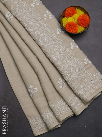 Khadi linen cotton saree beige with floral embroidery buttas and kantha stitch work pallu & border