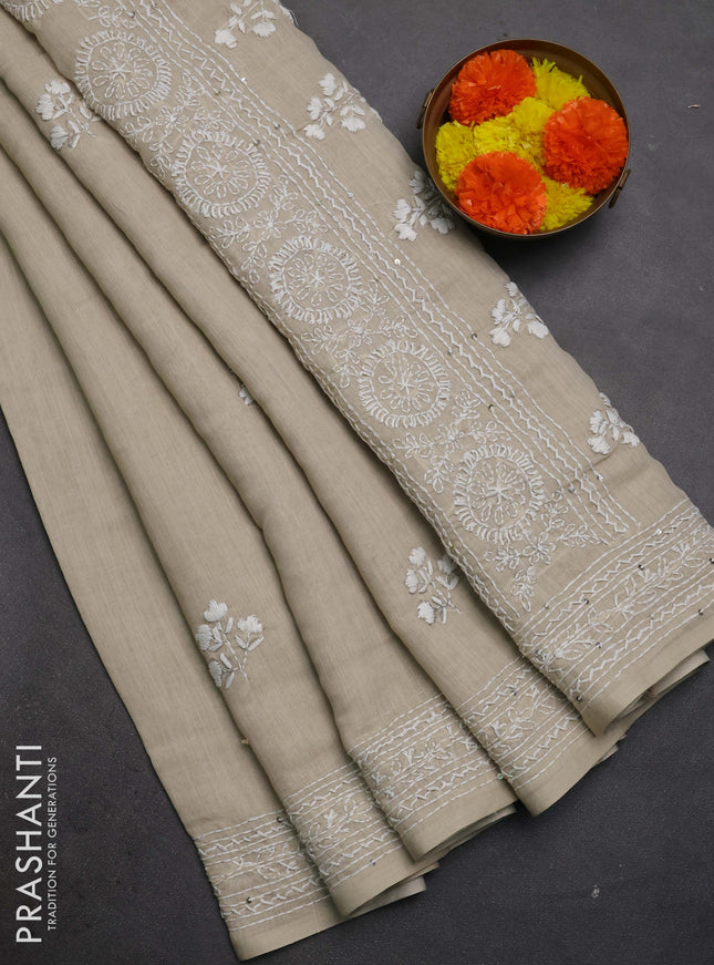 Khadi linen cotton saree beige with floral embroidery buttas and kantha stitch work pallu & border