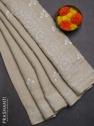 Khadi linen cotton saree beige with floral embroidery buttas and kantha stitch work pallu & border