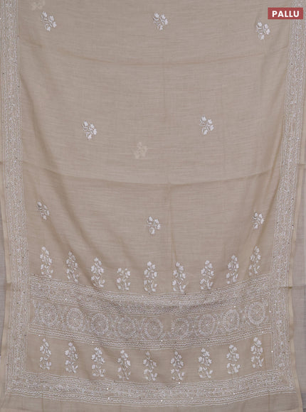 Khadi linen cotton saree beige with floral embroidery buttas and kantha stitch work pallu & border