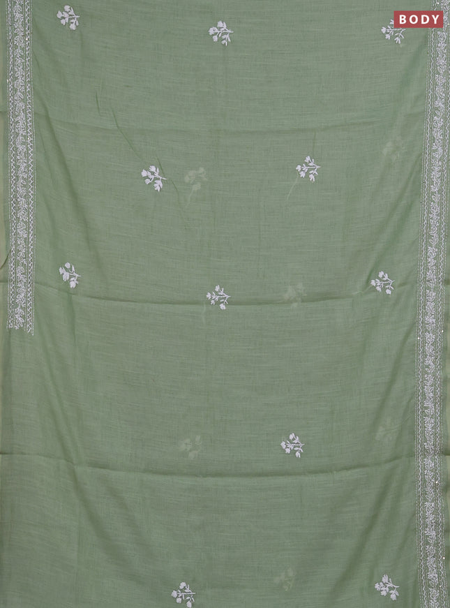 Khadi linen cotton saree pastel green with floral embroidery buttas and kantha stitch work pallu & border