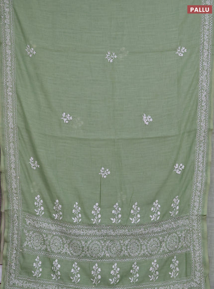 Khadi linen cotton saree pastel green with floral embroidery buttas and kantha stitch work pallu & border