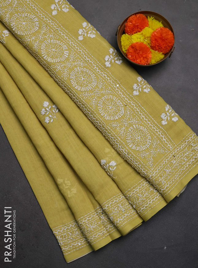 Khadi linen cotton saree lime yellow with floral embroidery buttas and kantha stitch work pallu & border