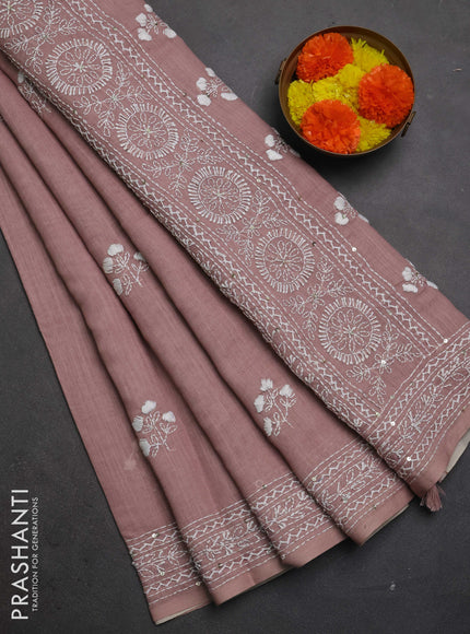 Khadi linen cotton saree pastel pink shade with floral embroidery buttas and kantha stitch work pallu & border