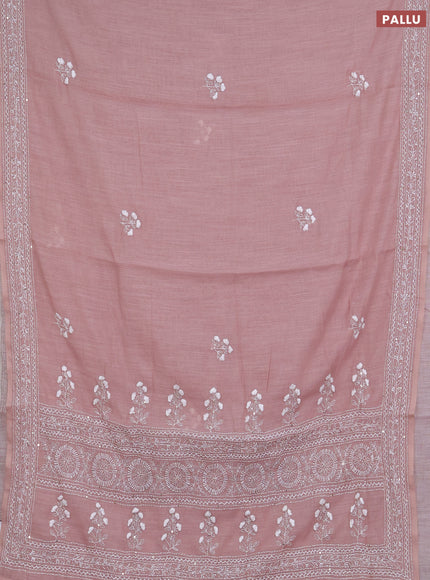 Khadi linen cotton saree pastel pink shade with floral embroidery buttas and kantha stitch work pallu & border