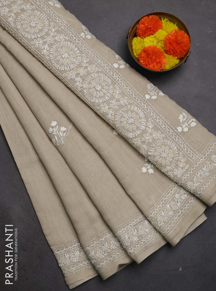 Khadi linen cotton saree beige with floral embroidery buttas and kantha stitch work pallu & border