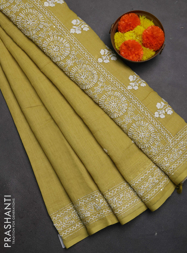 Khadi linen cotton saree lime yellow with floral embroidery buttas and kantha stitch work pallu & border