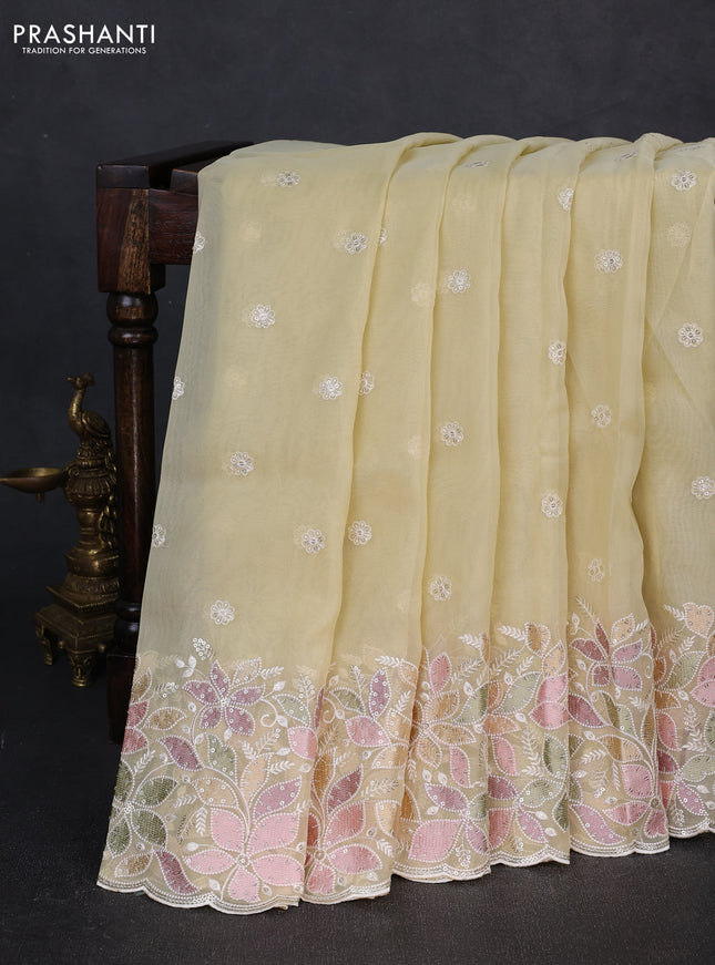 Organza saree pale yellow with embroidery sequin buttas and floral sequin embroidery border